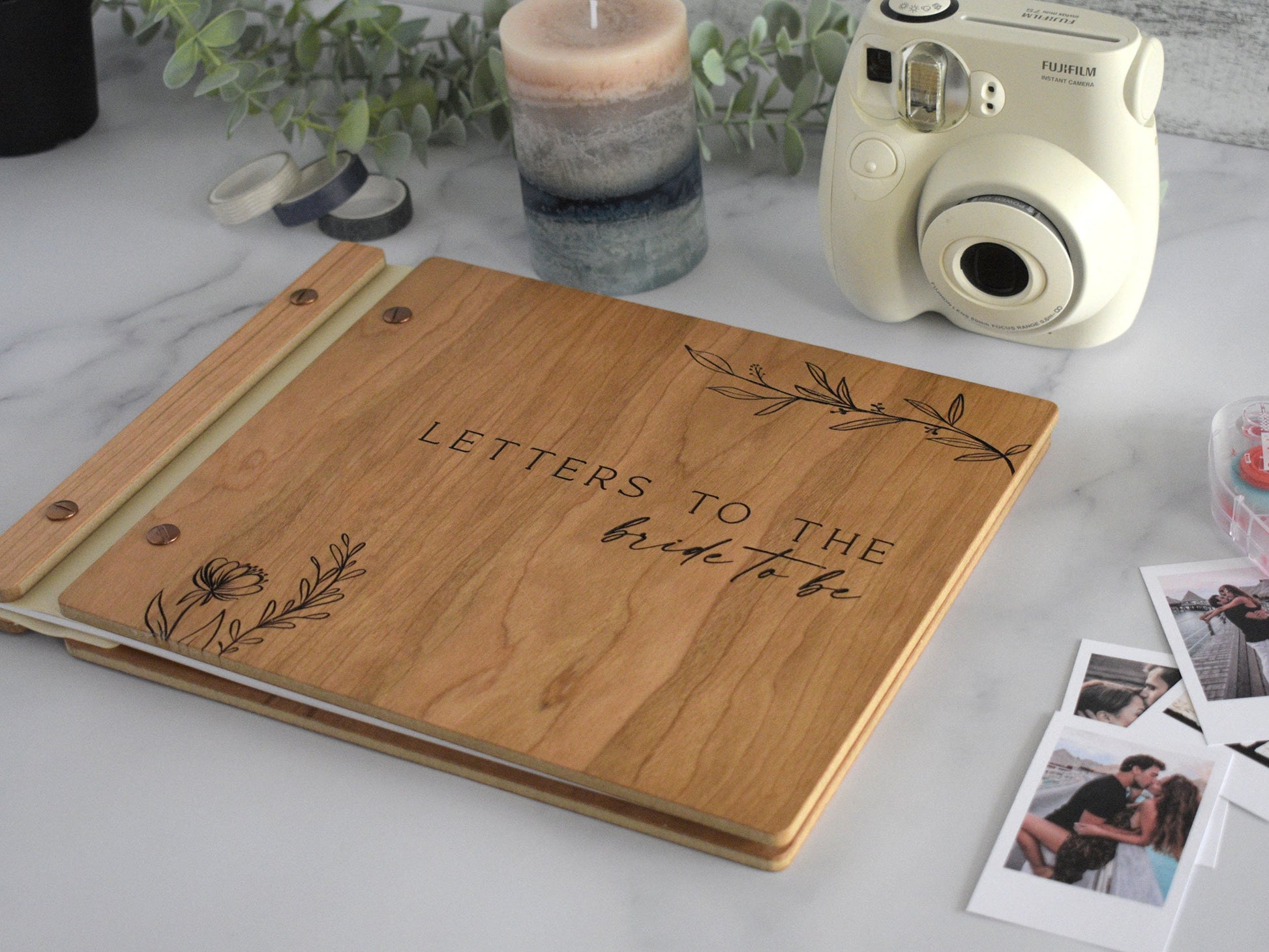 Minimalist letters to the bride guest book in cherry wood finish with engraved, customized and a boho leaf design on the cover.