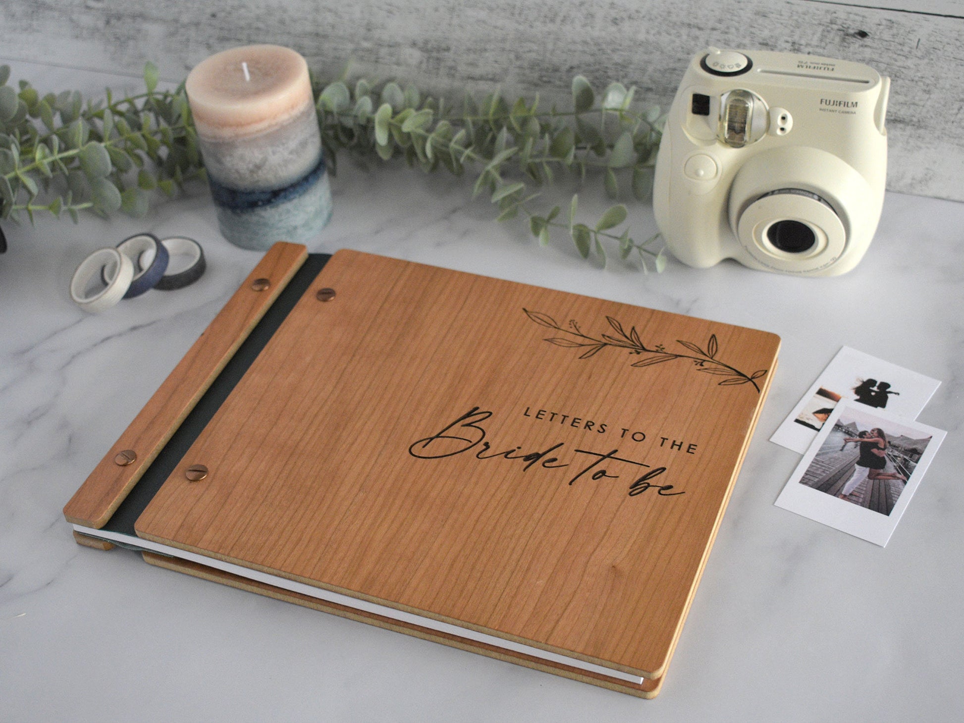 Engraved letters to the bride wooden wedding guest book in an cherry finish with customized couples names and minimalist design engraving.