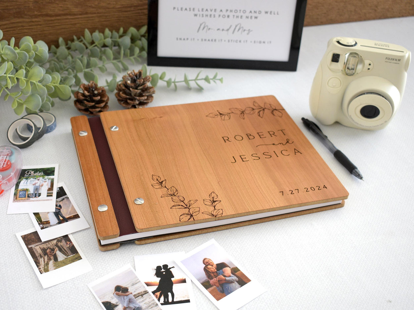 Custom wooden wedding guest book featuring elegant eucalyptus leaf engraving. Perfect for capturing special memories, this personalized guest book adds a touch of natural beauty and sophistication to your wedding or special event.