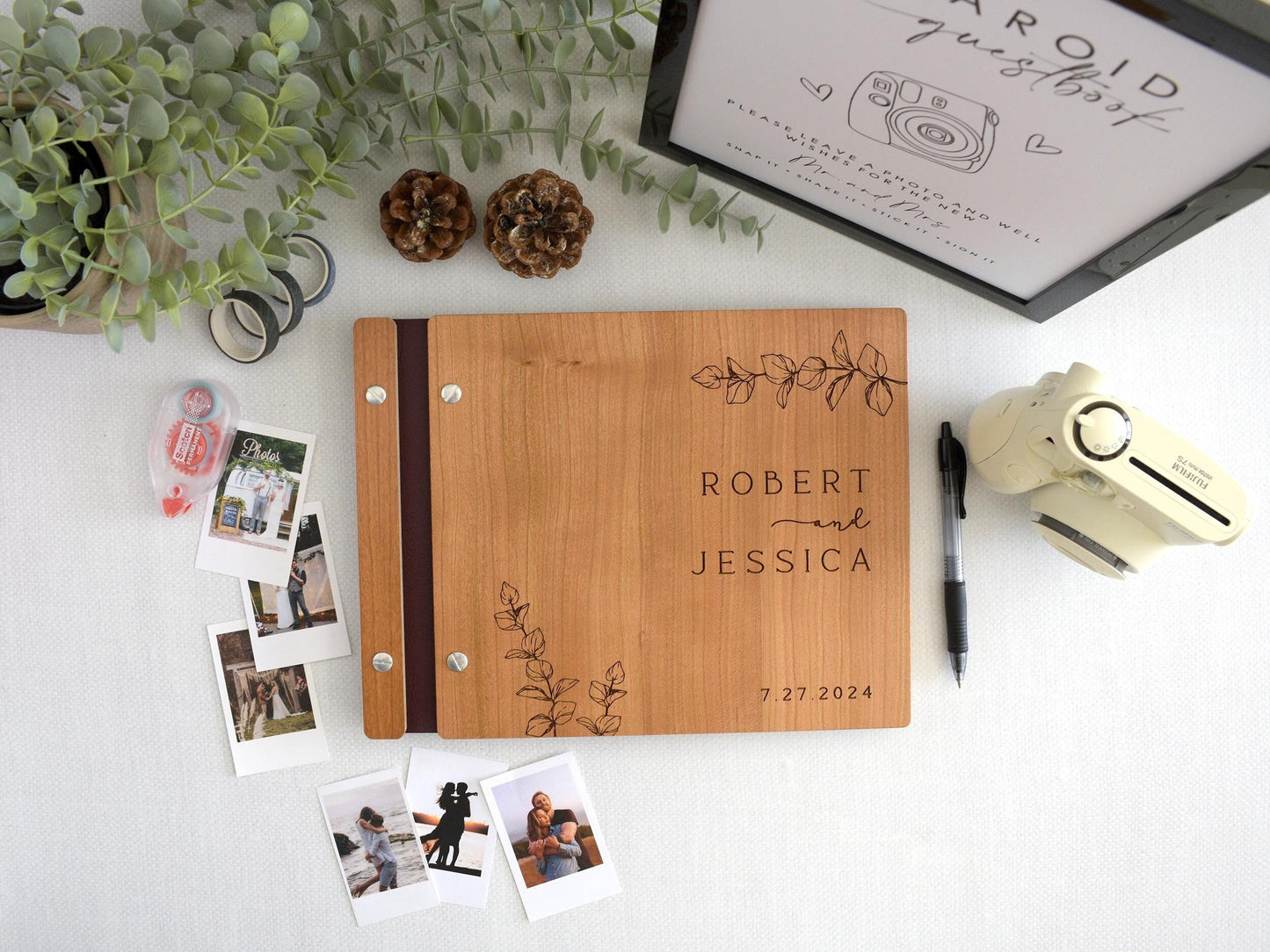 Custom wooden wedding guest book featuring elegant eucalyptus leaf engraving. Perfect for capturing special memories, this personalized guest book adds a touch of natural beauty and sophistication to your wedding or special event.