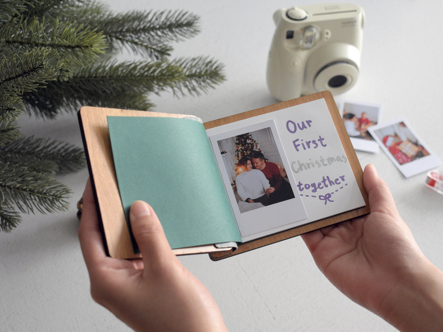 a person holding a book with a picture inside of it