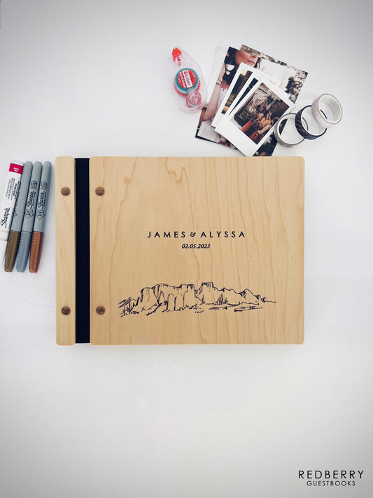 Custom wooden guestbook with engraved desert landscape design. Perfect for weddings, adventures, or special occasions. Features high-quality black binding and space for photos and messages. Ideal for capturing memories and personal notes.