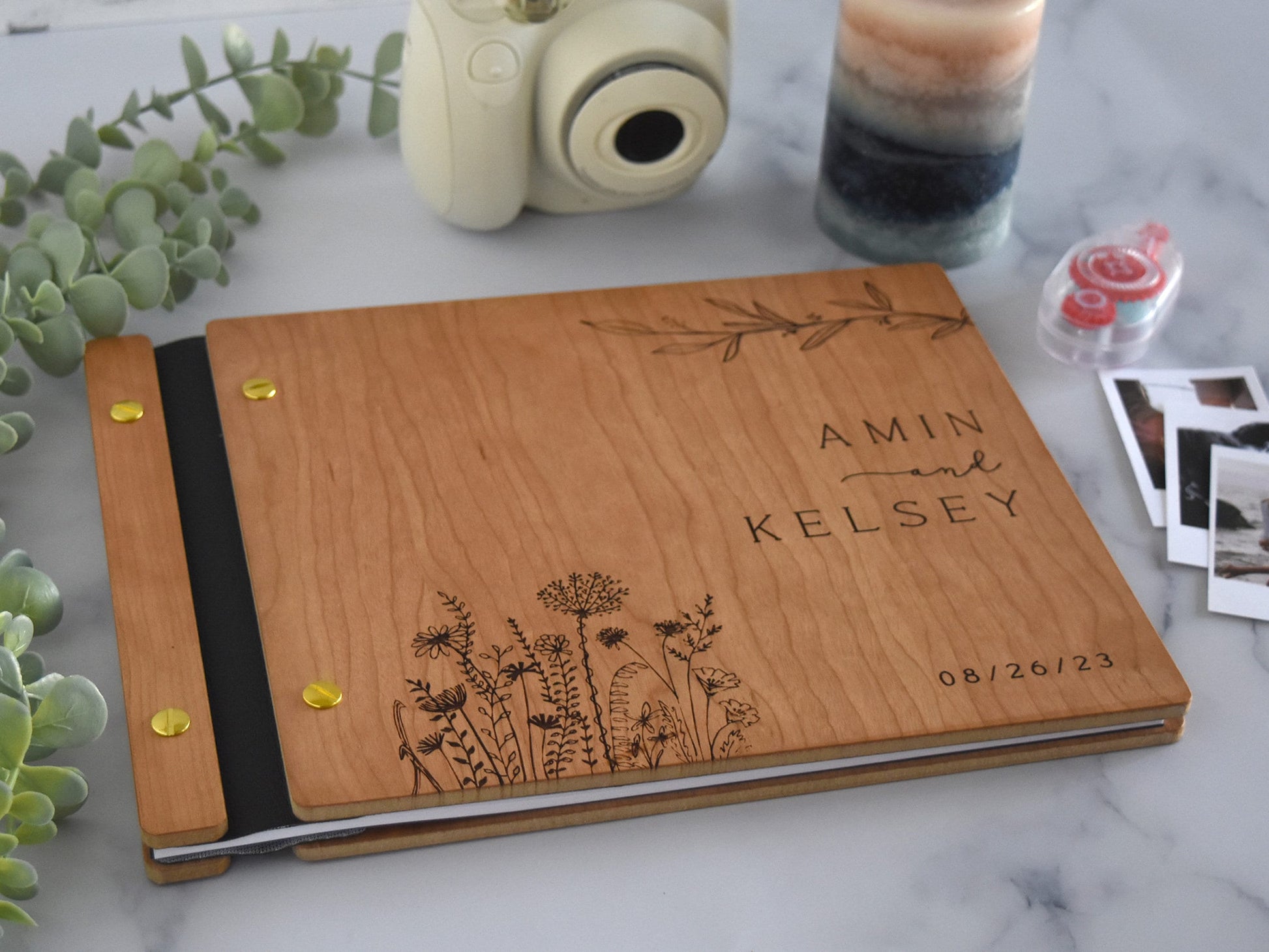 a wooden notebook with a picture of flowers on it